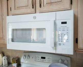 GE microwave oven less than one year old
