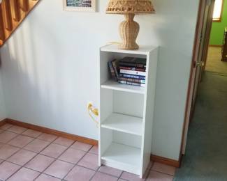 Bookcase; books; table lamp