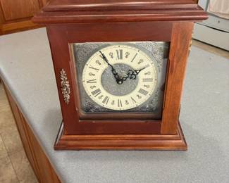 Cherry clock 13 1/2 tall,9 3/4wide 5 3/4 deep. Clock does not work.$100.00