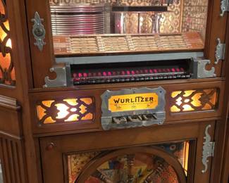 A restored and working 1940 vintage Wurlitzer 780 jukebox (wagon wheel mahogany wood)