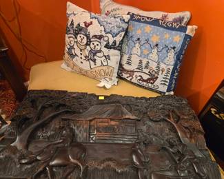 Wood carving is sitting on a modern faux suede ottoman for sale (excellent/brand new condition). Holiday pillows for sale!