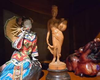 Lots of Asian porcelain and wood carvings are for sale!
