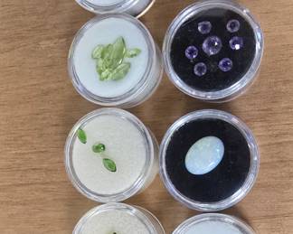 collection of semi-precious stones. diamonds, peridot, amethyst, topaz, citrine, and more