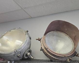 two large vintage nautical spot lights