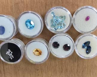 collection of semi-precious stones. diamonds, peridot, amethyst, topaz, citrine, and more