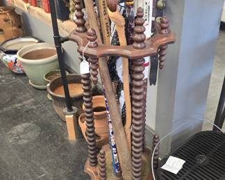 antique umbrella stand and canes 