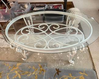 #50	Cream Iron Based Oval Coffee Table with beveled glass top - 46"x17.5"	 $ 50.00 																												