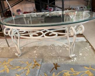 #50	Cream Iron Based Oval Coffee Table with beveled glass top - 46"x17.5"	 $ 50.00 																												