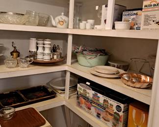 Serving pieces, salt and pepper sets, glassware, ramequins and more in this pantry