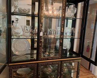 Lighted china cabinet with glass shelves and mirrored back