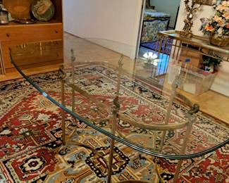 Brass and glass dining size table, room size rug