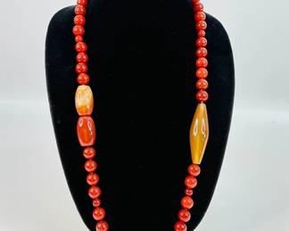 What appears to be a Carnelian Bead necklace. Necklace measures 30".