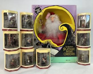 A Santa figurine from Nightmare Before Christmas, box dated 1993, plastic covering on box has fallen off but appears to be new in box. Also included are ten (10) Disney Tiny Kingdom Nightmare Before Christmas figures, boxes dated 1993, new in box. 