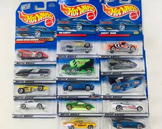 This lot includes 14 assorted Hot Wheels vehicles from 1998–2000, featuring collectible castings such as a Virtual Collection OshKosh Cement Truck, a classic ’63 T-Bird, a Treadator, and more. 
