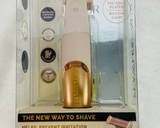 The Finishing Touch Flawless Nu Razor is a rechargeable, cordless dry shaver for women featuring a hypoallergenic 18K gold-plated head, bi-directional shaving, and an LED light for a painless, irritation-free grooming experience.