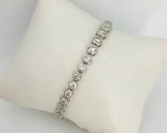 Platinum bracelet, stamped "Sheffield & Sons", mounted with (37) round diamonds, 8.74 ctw. 7.5" long finished with a tension lock clasp and folding safety clasp. 16.6 gtw. Includes appraisal dated September 24, 2024 by American International Gemological Laboratories, Inc. Matches necklace in Lot 20. Appraisal provided by consigner. 