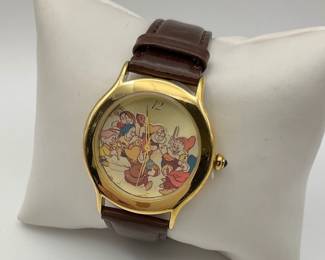 Disney Everlasting Time Limited Edition Snow White and the Seven Dwarfs watch. Circa 1998. Gold tone case, leather band. Some signs of wear, but overall good condition. 