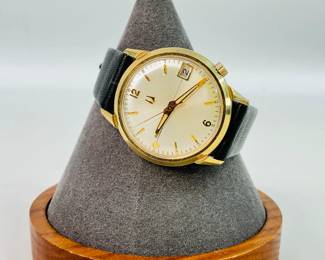 Bulova wristwatch, 14K gold-filled case with a leather band 18L, untested.