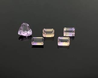 Ametrine's name is derived from a combination of amethyst and citrine. How perfect, then, to make a jewelry set from these (4) emerald cut ametrine gemstones and (1) heart cut amethyst. Ametrines are approximately 6mm x 8mm and 1.5 ct each. Amethyst is 2.85 ct and 10mm. 