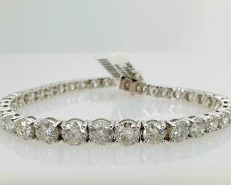 14K white gold 7.5" bracelet mounted with (37) round brilliant cut diamonds, 14.83 ctw. 18.3 gtw. Includes appraisal dated August 12, 2024 by GemAssure Gemological Appraisals. Appraisal provided by consigner.