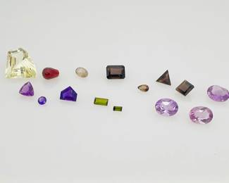 Fifteen (15) mixed gemstones, variety of sizes and cuts. Includes amethyst, garnet, citrine and more. 21.5 ctw. 