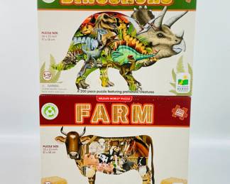 This lot includes two eco-friendly Wildlife World 200-piece puzzles—Farm and Dinosaurs—both featuring vibrant, animal-themed illustrations.
