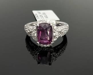 Platinum size 6.75 ring stamped "Oscar Friedman" with a GIA Certified 2.42 ct pink-purple Kashmir cushion cut sapphire at the center. (56) round brilliant cut diamonds surround the center stone and on each side of the band. 5.9 gtw. Includes appraisal dated October 8, 2025 by American International Gemological Laboratories, Inc. Appraisal provided by consigner. 