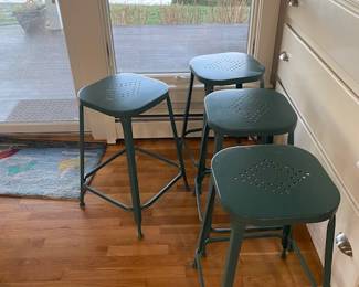 Four metal stools