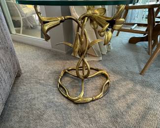 Detail of triple gold lilies on base is gold on aluminum