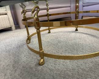 Detail of brass base with lovely swans on octagon glass top coffee table