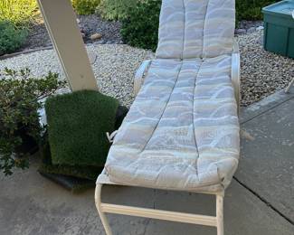 Adjustable lounger patio chair with brand new cushion that matches the four chair seat, cushions and umbrella so very 80s.