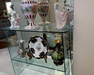 Glass display stand with assorted lovelies including Cloisonne and Lladro