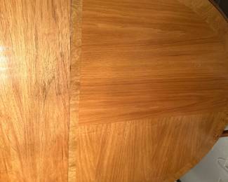 Tabletop has always been protected with pads and the wood is beautiful and pristine this Thomasville piece matches the entire dining room suite of cabinets