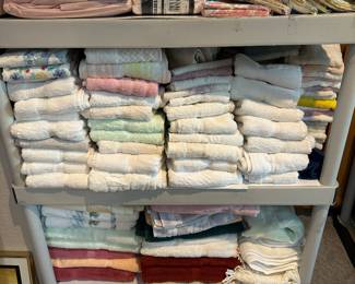 Bath towels, hand towels, and washcloths by the dozens in good condition