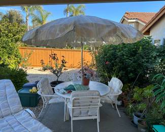 Includes heavy base for the Umbrella and it tilts.