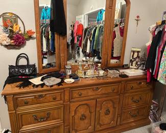 The Thomasville burl wood dresser with three-way mirror is 75 inches wide 