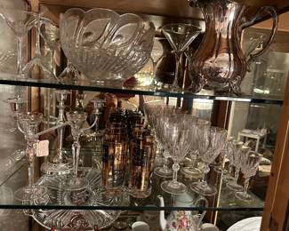 Set black and gold tumblers, stemware set, crystal candle holders silver plate candelabra etc.