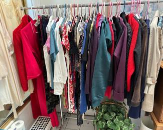 One of the four racks of clothing One with robes nightgowns coats jackets dresses