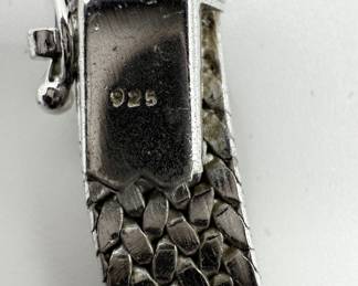 This sterling silver choker has a beautiful woven design and is in beautiful condition. 16 1/2" length is perfect for every day wear or to add some shine for more formal events. A total of 1.134 ozt makes this a great investment piece. 