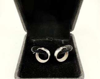 This is a pair of high polish hoop earrings 1/2 cm wide and in excellent condition. This set of classic hoops is a must for the distinguished jewelry wardrobe. Perfect for dressing up or every day wear. Earrings weigh .086 ozt and come in a beautiful box for gifting.  