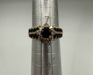 This gorgeous ring has a vibrant sapphire center stone surrounded by eight sparkling round cut diamonds all set in polished 14K gold. The ring is a size 7 1/2 and is ready to be gifted. Stones display a lovely fluorescence and the ring weights .151 ozt total with stones. Don't let this beauty slip away! Beautiful gift box included for your own storage or gifting. 