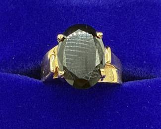 This is a 14K gold ring with an oval black stone, likely onyx. Stone is opaque and set in 14K gold. Ring weighs .12 ozt with stone and comes in lovely gift box for your own storage or gift giving. 