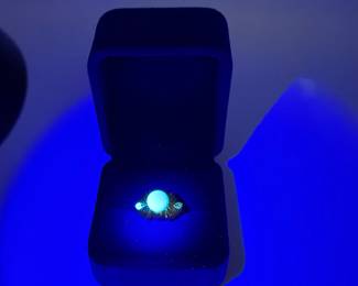 This is a beautiful classic pearl ring nestled in a 14K gold ribbon setting with two diamonds that have beautify fluorescence. This is a statement piece for any jewelry wardrobe. Size 7 1/2 and a total weight of .145 ozt with the pearl and diamonds. Beautiful gift box included for your own use or gifting. 