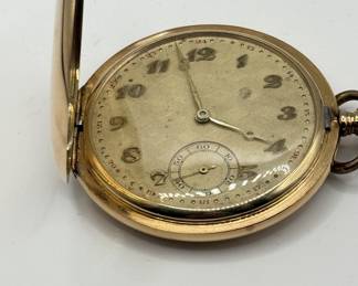 This is a beautiful 14K solid gold pocket watch. It features Arabic numbers and a second dial. Sleek and modern style, this time piece is a great gift for history lovers or those looking for an investment time piece. Ready to be personalized or engraved to mark a special occasion.