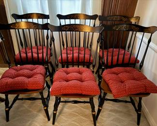 A set of 6 Hitchcock black and gold decorated spindle back chairs.
