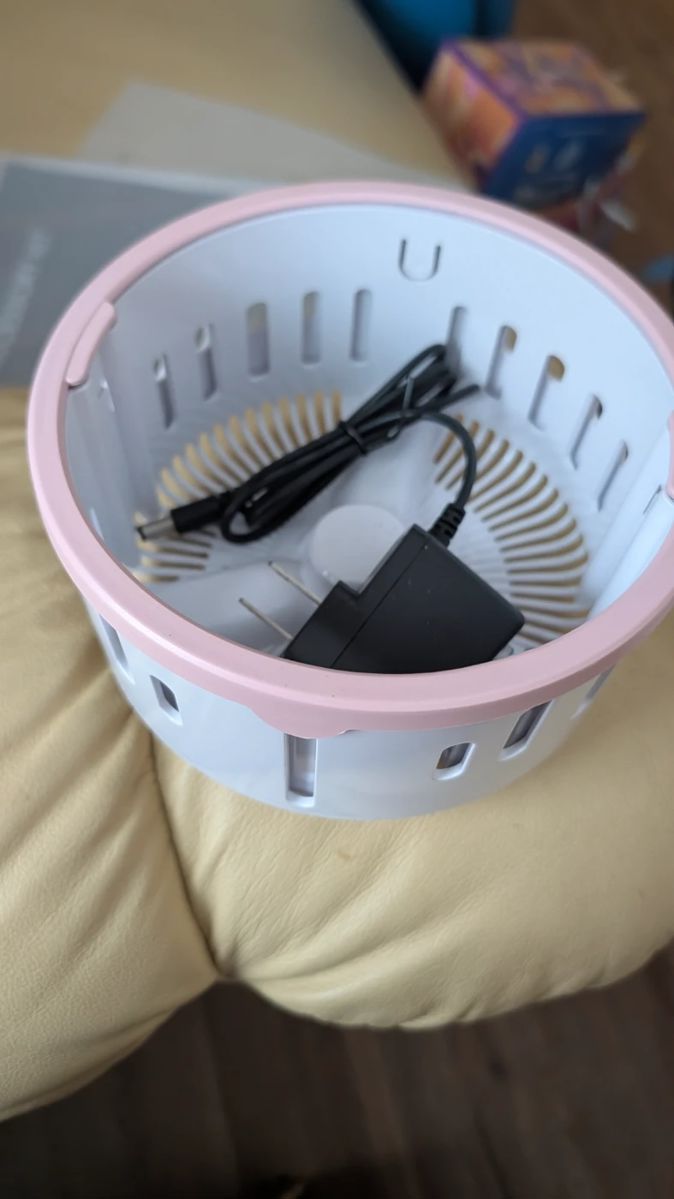 WHOEVER BOUGHT THE LITTLE PINK LIKE WASHING MACHINE PORTABLE HERE'S THE INSERT AND A PLUG WE BELIEVE GOES WITH IT PICK IT UP SUNDAY! OR CALL ME