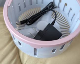 WHOEVER BOUGHT THE LITTLE PINK LIKE WASHING MACHINE PORTABLE HERE'S THE INSERT AND A PLUG WE BELIEVE GOES WITH IT PICK IT UP SUNDAY! OR CALL ME