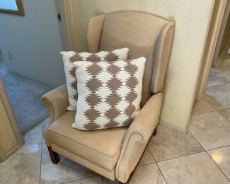 Beige wingback, is a recliner