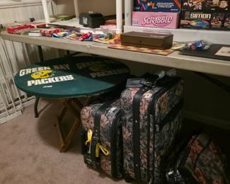 Green Bay Packers table, suitcases & various bags