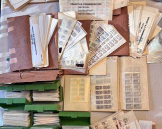 Extensive US postage stamp collection. Mint/unused plate blocks, full sheets, face value postage, and commemoratives. Stored in archival envelopes.
